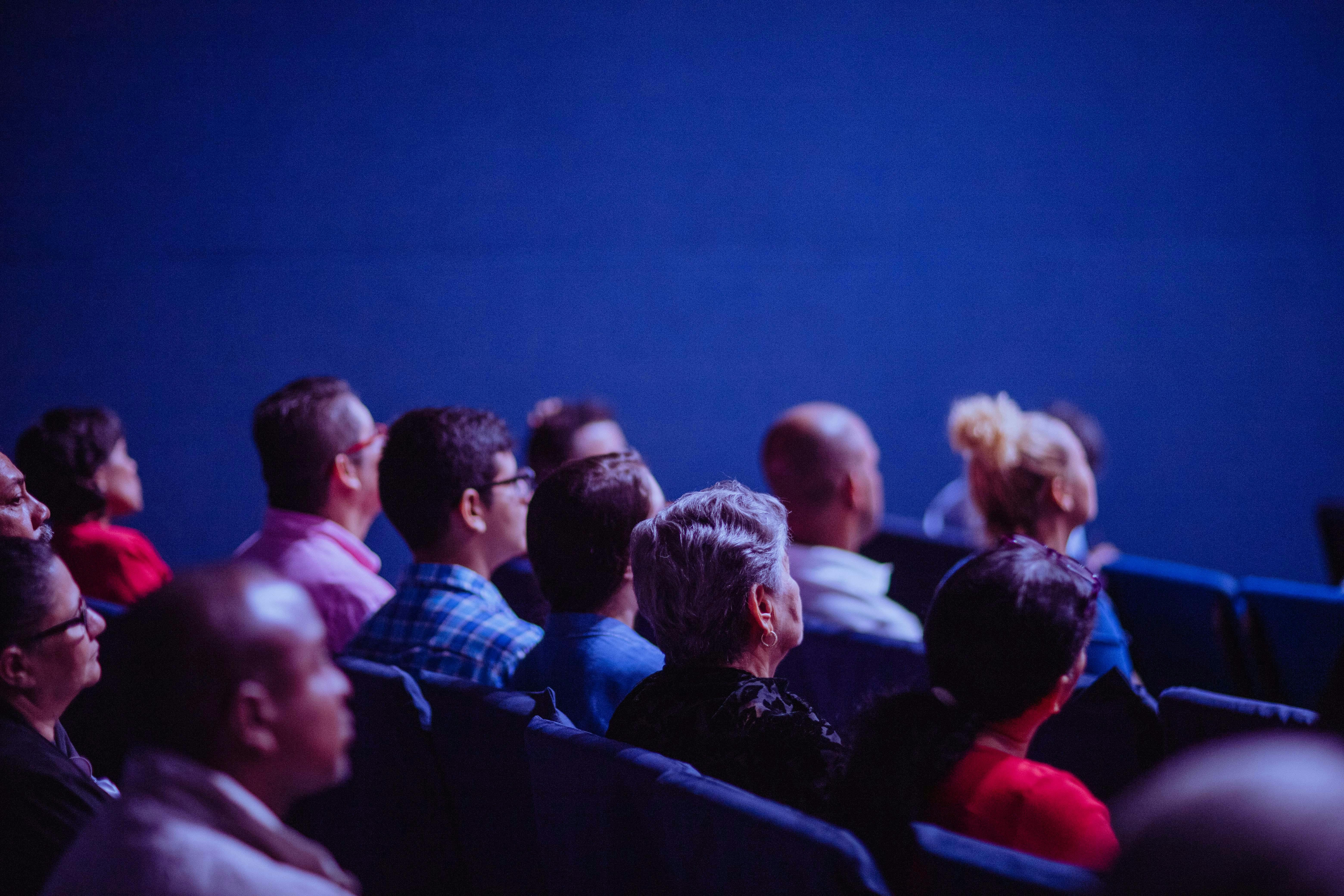 A group of people focused on the screen